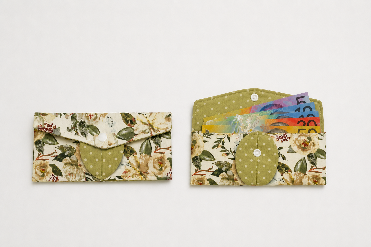 Two fabric card sleeves or wallet-style pouches shown on a plain light background. The left one is closed, showing a floral print with a green polka-dot heart detail.